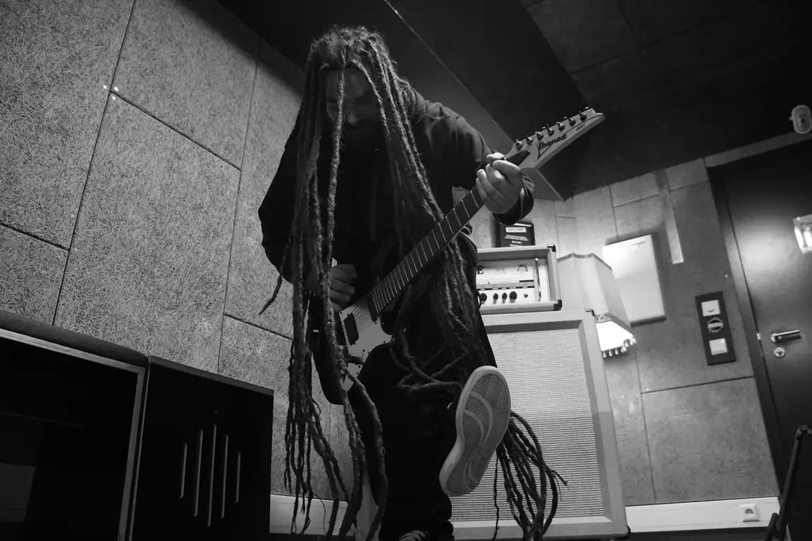 Adam playing electric guitar